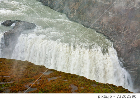 Closeup of Gullfoss waterfall in a cloudy day 72202590