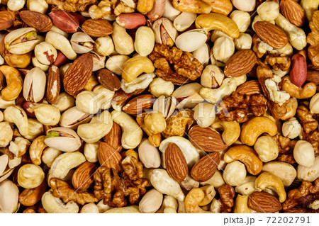 Background of mixed nuts (walnuts, pistachio, almond, peanut, cashew, hazelnut). Healthy eating concept 72202791