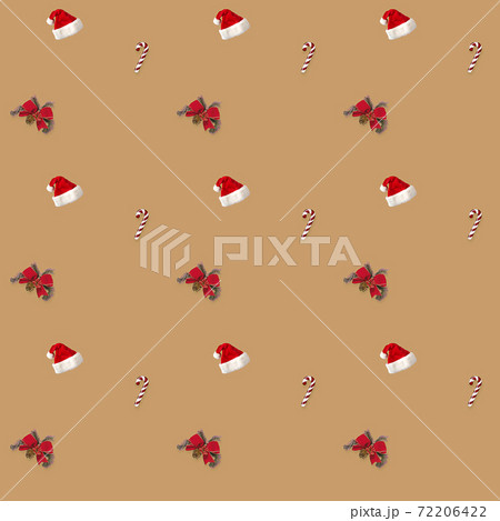 seamless pattern Santa hat, bow and candy cane candy cane on brown background 72206422
