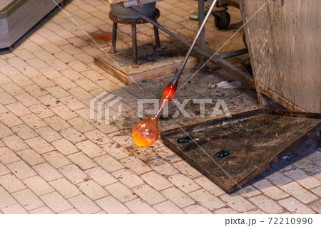 Glass blowing artwork produced under high temperature flame at workshop 72210990