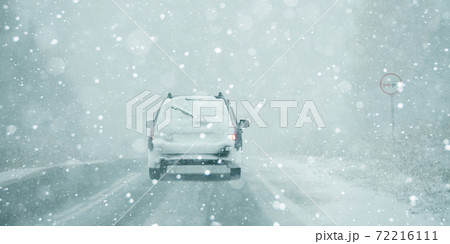 The car is driving on a winter road  72216111