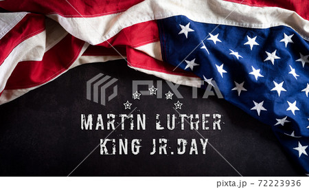 Happy Martin Luther King Day concept. American flag againt dark stone background Happy Martin Luther King Day concept. American flag againt dark stone background 72223936