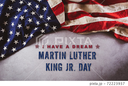 Happy Martin Luther King Day concept.  American flag againt dark stone background 72223937