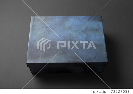 Shoe box in blue on a gray background. Shoe box in blue on a gray background. 72227053