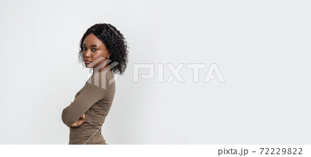 Upset black woman with arms crossed on grey Upset black woman with arms crossed on grey 72229822