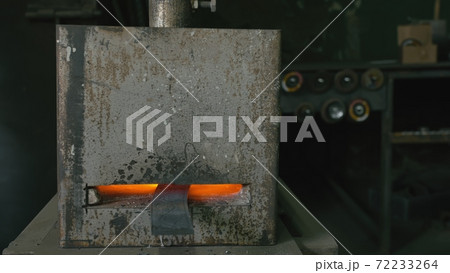 Forge workshop. Smithy manual production. Gas furnace for heating metal. Modern melting stove for iron steel. Blacksmith makes iron products. Forge workshop. Smithy manual production. Gas furnace for heating metal. Modern melting stove for iron steel. Blacksmith makes iron products. 72233264