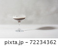 Jelly coffee with milk in a glass bowl in soft light. White background. 72234362