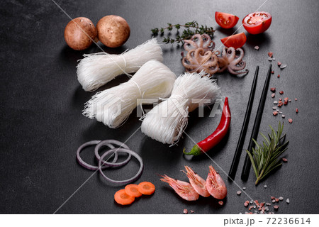 Tasty rice noodles with tomato, red pepper, mushrooms and seafood Tasty rice noodles with tomato, red pepper, mushrooms and seafood 72236614