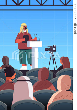 arab male doctor giving speech at tribune with microphone medical conference meeting 72239595