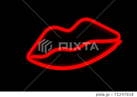 Blurry neon red lips close-up on a black isolated background. Blurry neon red lips close-up on a black isolated background. 72247018