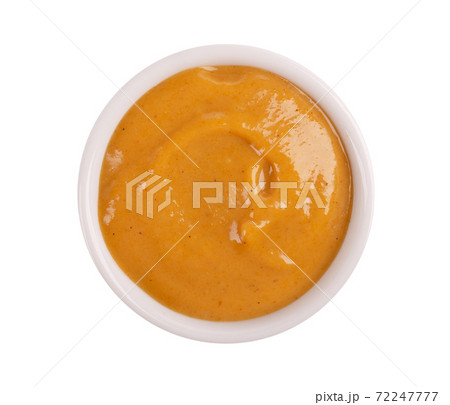 Mustard sauce in bowl, isolated on white background. Honey mustard salad dressing. Top view. 72247777