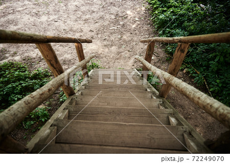 Wooden stairs for descent down and rise up. Old wooden steps Wooden stairs for descent down and rise up. Old wooden steps 72249070
