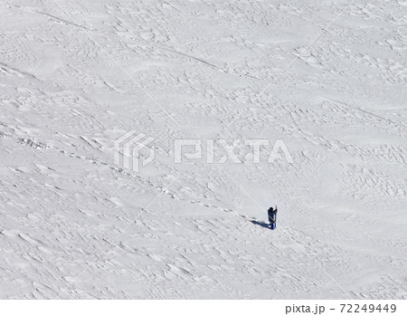 Snowboarder on snowy slope for freeriding at sun winter day Snowboarder on snowy slope for freeriding at sun winter day 72249449
