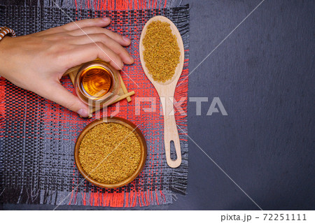 Fenugreek Seeds or MethiDana drink by speaking it in water overnight. close up. flat lay. copyspase 72251111