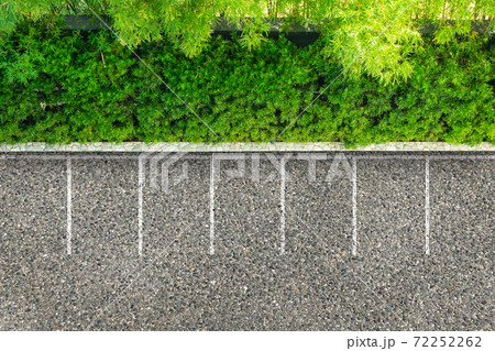 Empty space parking lot on asphalt road nearly green bush and trees. Empty space parking lot on asphalt road nearly green bush and trees. 72252262