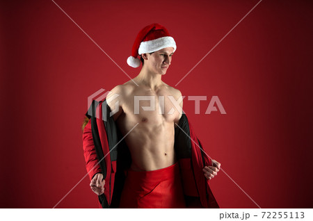 New year party erotic show. Bodybuilder santa claus. New year party erotic show. Bodybuilder santa claus. 72255113