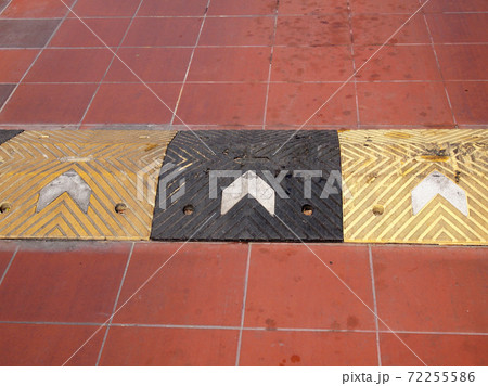 closeup of road with red and white line 72255586