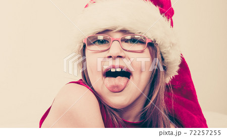 Little girl looking like santa elf. Little girl looking like santa elf. 72257255