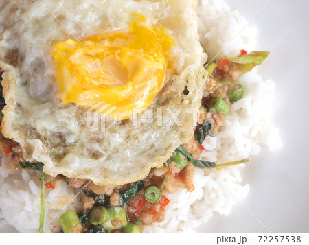 Close up Rice topped with stir fried pork and basil 72257538