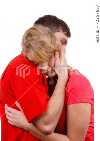 Couple. Woman is sad and being consoled by his partner Couple. Woman is sad and being consoled by his partner 72257667