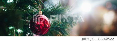 Luxury ornament red ball hang on Christmas tree decorate in supermarket 72260522