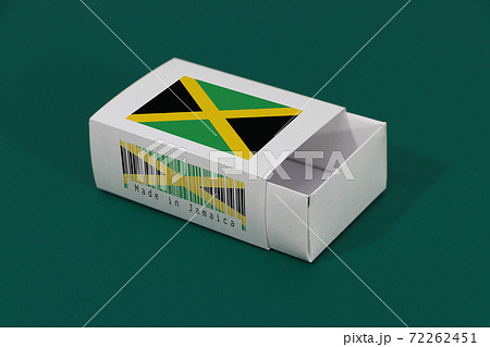 Jamaica flag on white box with barcode and the color of nation flag on green background Jamaica flag on white box with barcode and the color of nation flag on green background 72262451