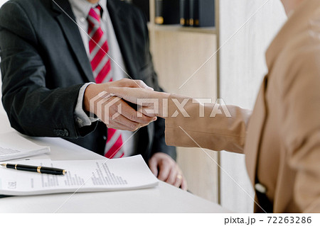 Lawyer consultant shaking hand with client in law firm.. 72263286
