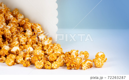 Sweet caramel candy popcorn in a basket Sweet caramel candy popcorn in a basket 72263287
