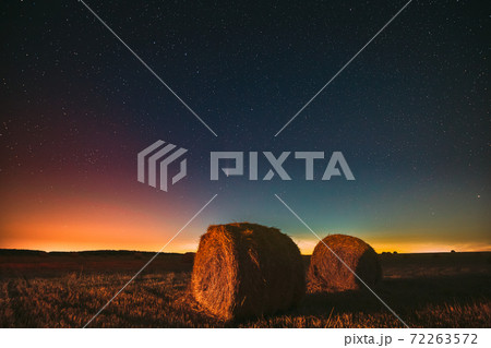 Comet Neowise C2020 F3 In Night Starry Sky Above Haystacks In Summer Agricultural Field. Night Stars Above Rural Landscape With Hay Bales After Harvest. Agricultural Concept 72263572