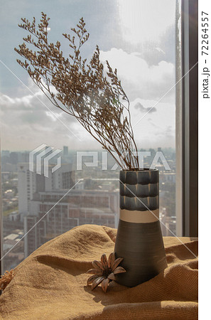 Dried flowers in beautiful ceramic blue vase handmade on table. Dried flowers in beautiful ceramic blue vase handmade on table. 72264557