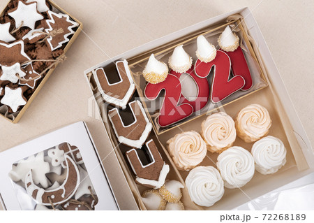 Gingerbread, gingerbread houses and marshmallows in christmas box. Holiday baked goods 72268189
