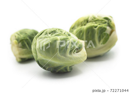 Closeup of organic brussels sprouts on white background Closeup of organic brussels sprouts on white background 72271044