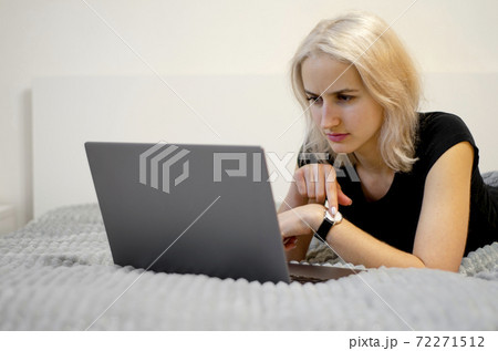 The displeased girl points to the clock. Late for a meeting. The displeased girl points to the clock. Late for a meeting. 72271512