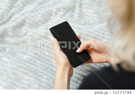 A young girl is using her mobile phone. Communication at a distance. A young girl is using her mobile phone. Communication at a distance. 72271794