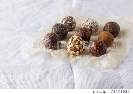 Healthy energy balls with oatmeal, chia seed, coconut flakes, cocoa and dried fruits. Healthy energy balls with oatmeal, chia seed, coconut flakes, cocoa and dried fruits. 72271980