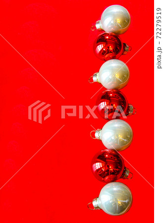 Christmas composition with white and red balls on red background, copy space. Flat lay, concept with festive ornaments. 72279519