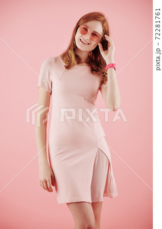 Cheerful young red haired woman 72281761