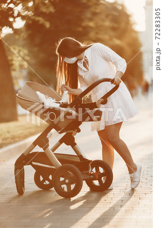 Woman with face mask for protection from coronavirus Woman with face mask for protection from coronavirus 72283305