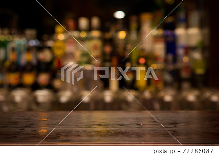 Empty wooden table in Irish pub and restaurant for present product 72286087
