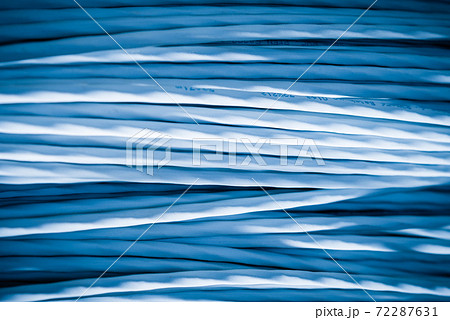 bunch of network cables in wave pattern leading across server ro bunch of network cables in wave pattern leading across server ro 72287631