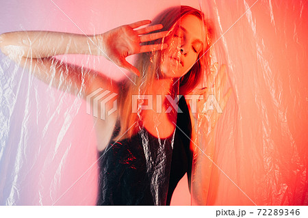 neon light portrait peaceful woman daydreaming 72289346