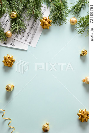 Empty blank for Christmas Carols and sings decorated golden balls on blue background. Empty blank for Christmas Carols and sings decorated golden balls on blue background. 72289761