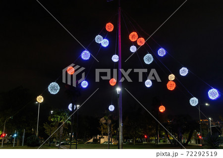 Night view of colourful Christmas balls decorations at a city square. 72292519