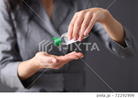 Woman applies hand sanitizer. Hand treatment from viruses Woman applies hand sanitizer. Hand treatment from viruses 72292906