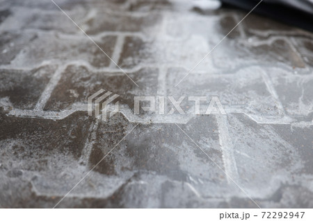 Road is covered with a thin layer of ice. Road is covered with a thin layer of ice. 72292947