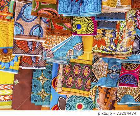 Display of multicolored ethnic pareo with floral and geometric shapes, Antananarivo market, Madagascar 72294474