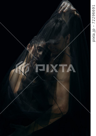 Graceful classic ballet dancers isolated on black studio background. The grace, artist, movement, action and motion concept. 72296691