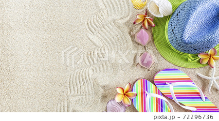 ..Blue and green straw Hat and colorful Flip Flops in the sand with shells and frangipani flowers. Summertime on beach concept, copy space .. ..Blue and green straw Hat and colorful Flip Flops in the sand with shells and frangipani flowers. Summertime on beach concept, copy space .. 72296736