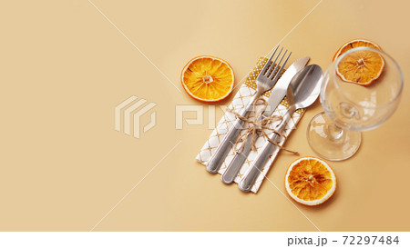 Setting of table with dry orange Setting of table with dry orange 72297484