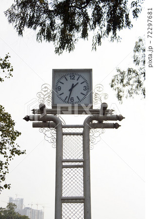 White Square Clock on the steel structure. the afternoon of outdoor timepiece in the public park. White Square Clock on the steel structure. the afternoon of outdoor timepiece in the public park. 72297681